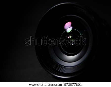 Closeup camera len photographer on dark background wallpaper lowkey