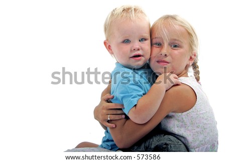 little boy and girl hugging and smiling