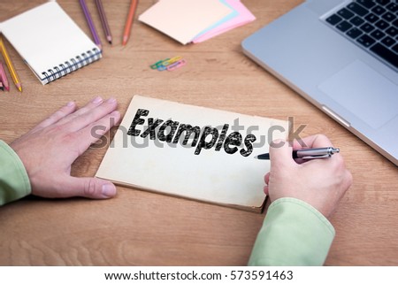 Hand writing Examples. Office desk with a laptop and stationery