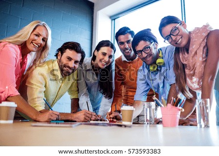 Group of designers drawing in the office