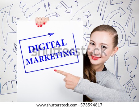 Young woman holding whiteboard with writing word: digital marketing. Technology, internet, business and marketing.