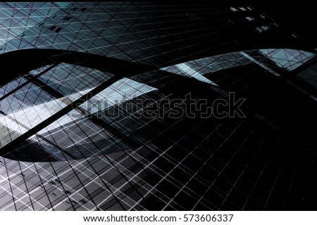 Modern glass architecture with curvilinear shapes in darkness. Grunge photo of skyscraper / multistory office building with structural glazing. Abstraction on the subject of industry or technology