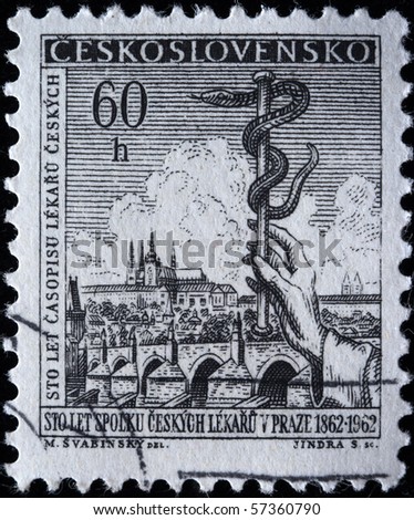  Czechoslovakia - CURCA 1962: A postage stamp was printed in Czechoslovakia, is devoted 100 years of union of doctors Prague shows the symbol of medicine - the snake in the background of the city