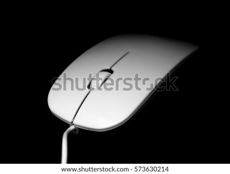 white mouse for the computer on a black background