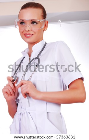 Young nurse in white uniform, transparent glasses and a stethoscope isolated on white