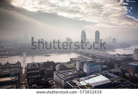 rooftop view from top of St Paul's Cathedral on a foggy day in London, UK