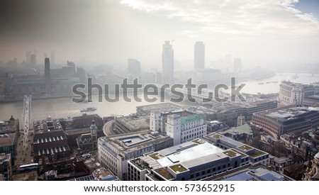 rooftop view from top of St Paul's Cathedral on a foggy day in London, UK