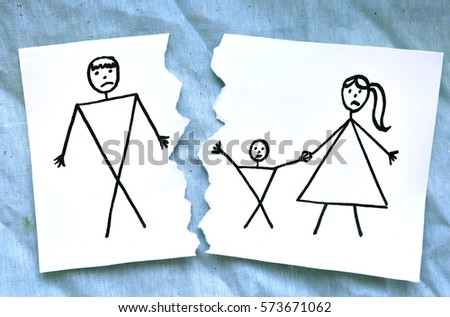 dad and mom with son divorce drawing on torn paper on blue cloth background