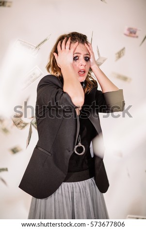 she was crying and flying around money. White background, Studio light
