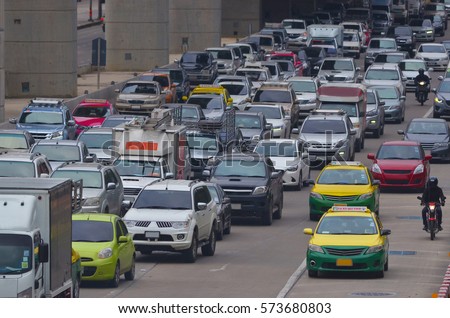 cars in traffic jam in a city during rush hour Royalty-Free Stock Photo #573680803