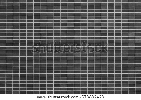 Black stone tile wall seamless background and pattern