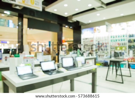 Blurred interior shop with computers and  office equipment for background