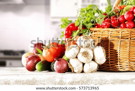 Vegetables in kitchen on white wooden table and free space for your decoration 