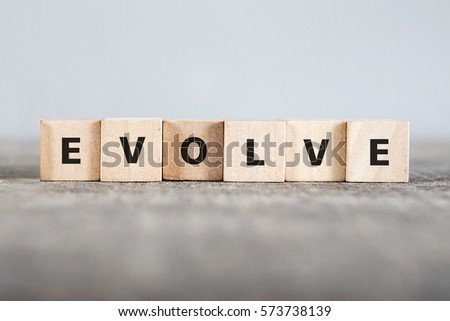EVOLVE word made with building blocks Royalty-Free Stock Photo #573738139