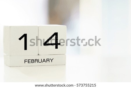 Wooden calendar 14 February with vintage color tone process for valentine day concept background and copy space .