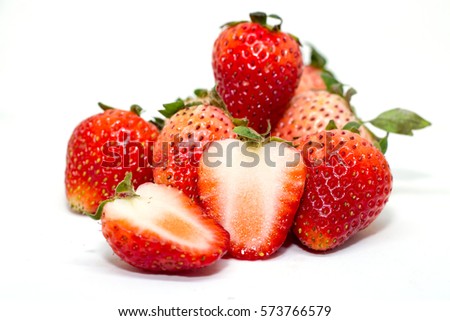 Raw strawberries on the white background.