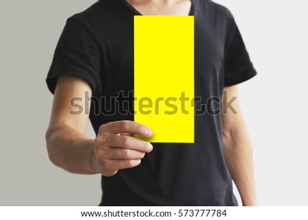 Man showing blank yellow flyer brochure booklet. Leaflet presentation. Pamphlet hold hands. Man show clear offset paper. Sheet template. Booklet design sheet display read first person