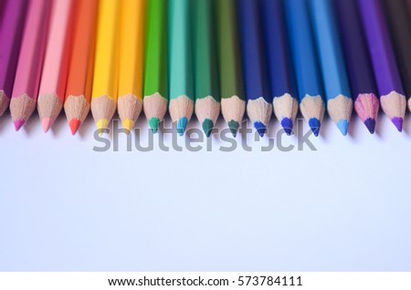 Colour pencils isolated on white background. Macro with extremely shallow depth of field in copy space