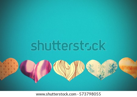 holiday letter. multicolored hearts on a blue background. greeting card. instagram image filter retro style