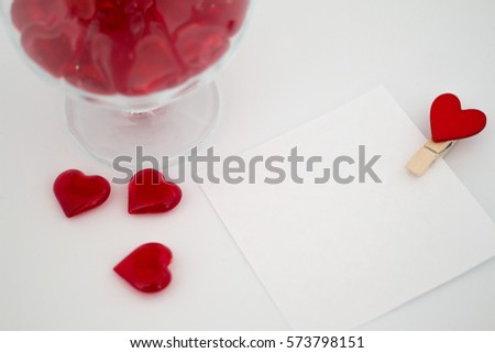 love letter, hearts and glass on a white background