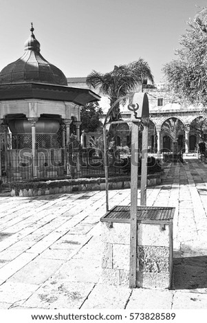 Garden in the courtyard of Muslim mosque in the old city of Akko. Al-Jazzar mosque as fine example of the Ottoman architecture in old Acre, Israel. Black and white picture