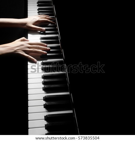 Piano player. Pianist playing musical instrument close up. Grand piano with hands closeup