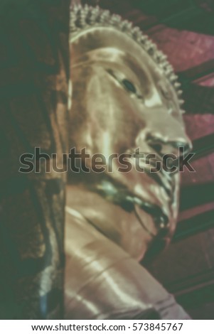 Blurred abstract background of Buddha statue