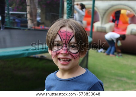 Boy with his face painted 