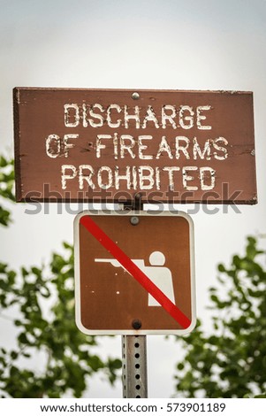 Sign prohibiting use of firearms, Beluga Point Lookout, Seward Highway, Alaska, USA