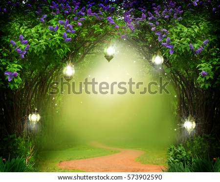 Fantasy  background . Magic forest with road.Beautiful spring  landscape.Lilac trees in blossom  Royalty-Free Stock Photo #573902590