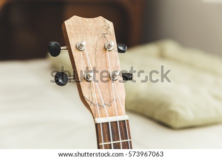 Closeup of ukulele head stock.