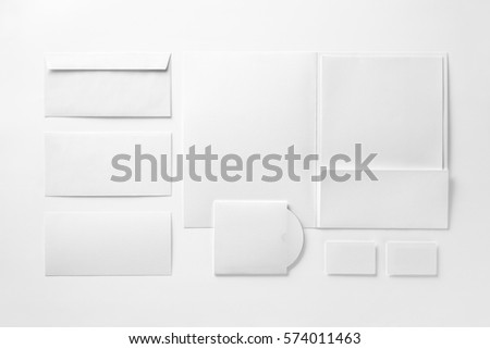 Corporate stationery set mockup. Presentation folder, letterhead, envelopes, business cards isolated at white paper background. 