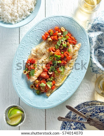 Delicious white fish veracruz with olives, capers, tomato, jalapeno pepper and cilantro.