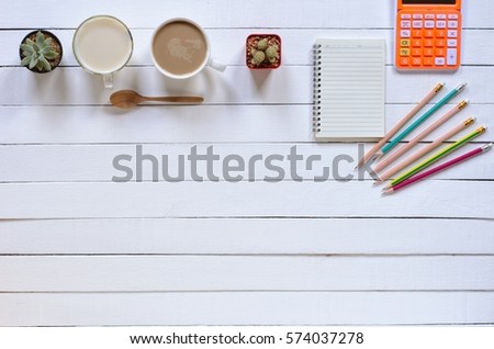Office stuff and it gadgets display on top view business desk with copy space at text of picture. Creative table, modern project. Business empty vintage is background. Dark tone filter effects.