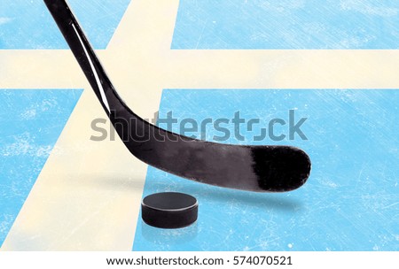 Sweden flag embedded on ice hockey rink surface with stick and puck. Low angle view and copy space.
