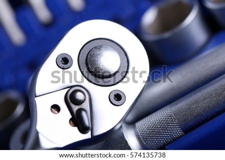 Set of tools closeup (various wrench heads and tips in blue plastic case). Car repair kit, professional instrument shop or store concept