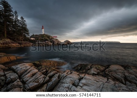 Beautiful view of the Light House during a cloudy winter sunset. Picture taken in Lighthouse Park, West Vancouver, British Columbia, Canada.