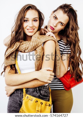 best friends teenage girls together having fun, posing emotional on white background, besties happy smiling, lifestyle people concept 