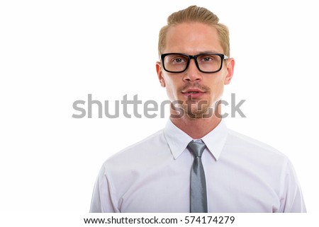 Studio shot of young handsome businessman wearing eyeglasses