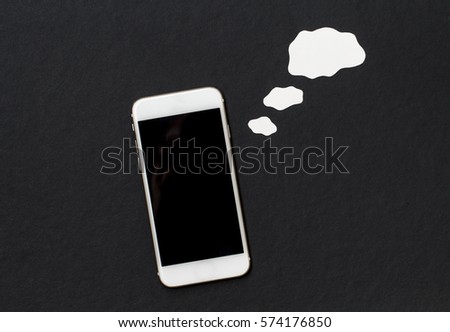 White phone with blank text cloud. Smartphone and cartoon style cloud. Cellphone banner template with text place. Black and white background with Iphone top view. Though or idea bubble and phone photo