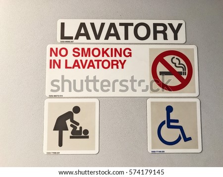 Lavatory door safety sign and symbol in airplane