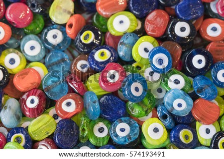 Colored beads with a picture of the eyes, background
