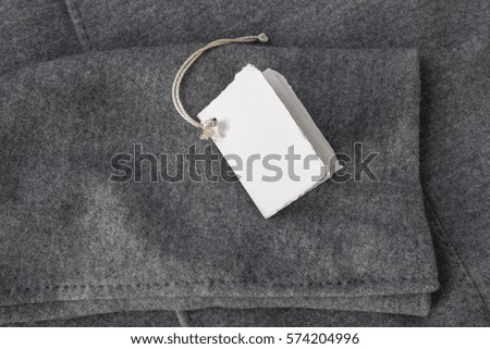 Tag on a Gray Woolen Coat