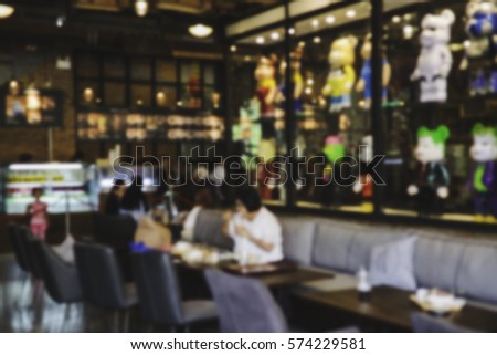 People in Coffee shop blur background with bokeh lights, vintage filter for old effect, blurred background