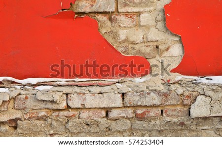 Old house oranzhevaya Crumbling wall brick facade.