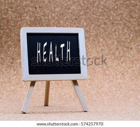 Stand blackboard written "HEALTH" with brown background.