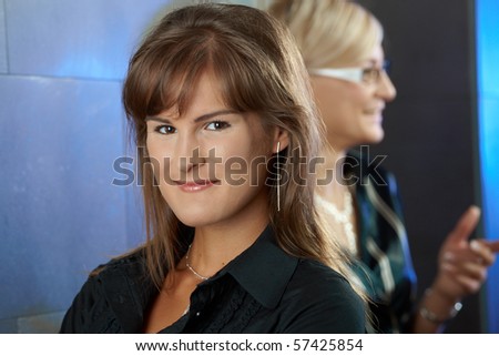 Closeup portrait of young businesswoman, smiling.