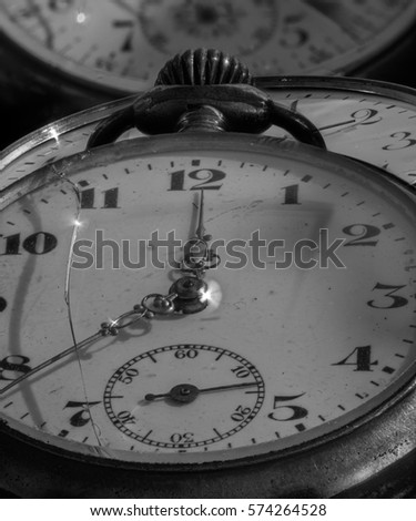 Still life monochrome macro of ancient historic old pocket watches, symbolic decay, fading,time,past,aging,age,carpe diem