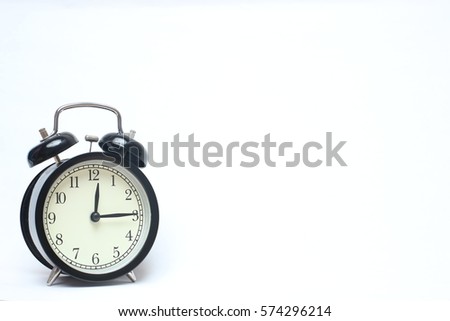 Retro alarm clock on white background.
