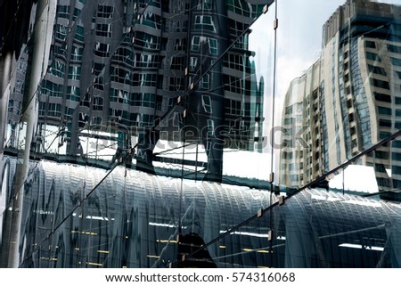 Backgrounds of Modern architecture with windows glass reflection of city.